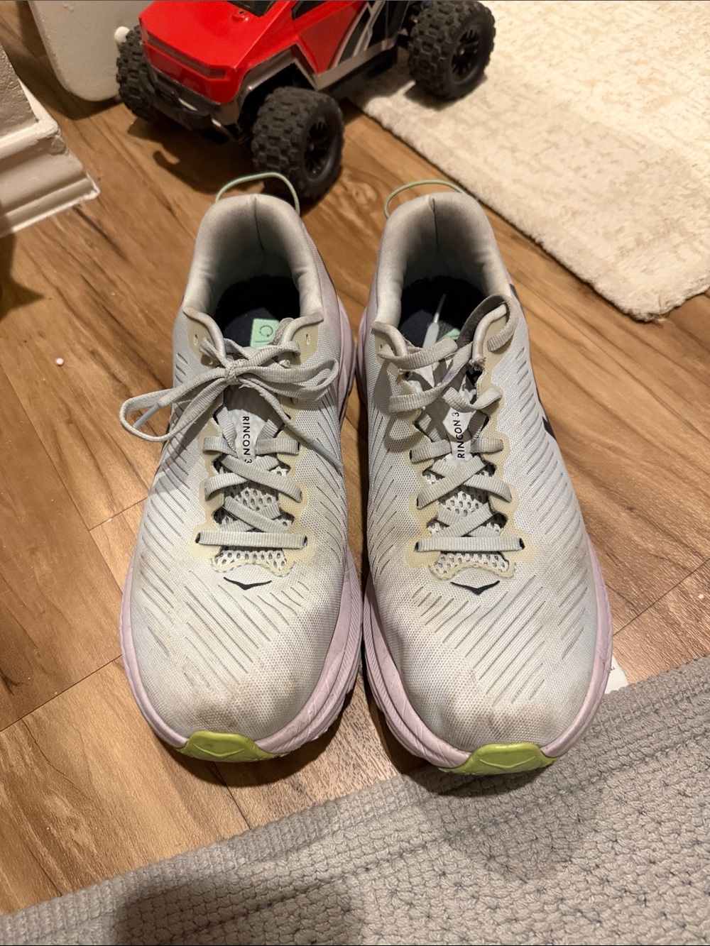 Hoka Women's Light Gray Running Shoes with Pastel Pink and Lime Accents